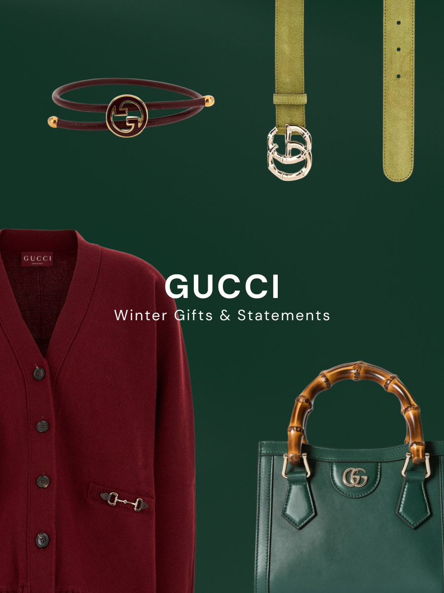 Gucci winter campaign on green background featuring burgundy leather wrap bracelet with GG logo, olive suede belt with silver GG buckle, burgundy wool cardigan with horsebit detail, and green leather handbag with bamboo handles.