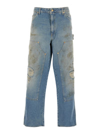 Light Blue Jeans With Ripped Details And Distressed Effect In Denim Man