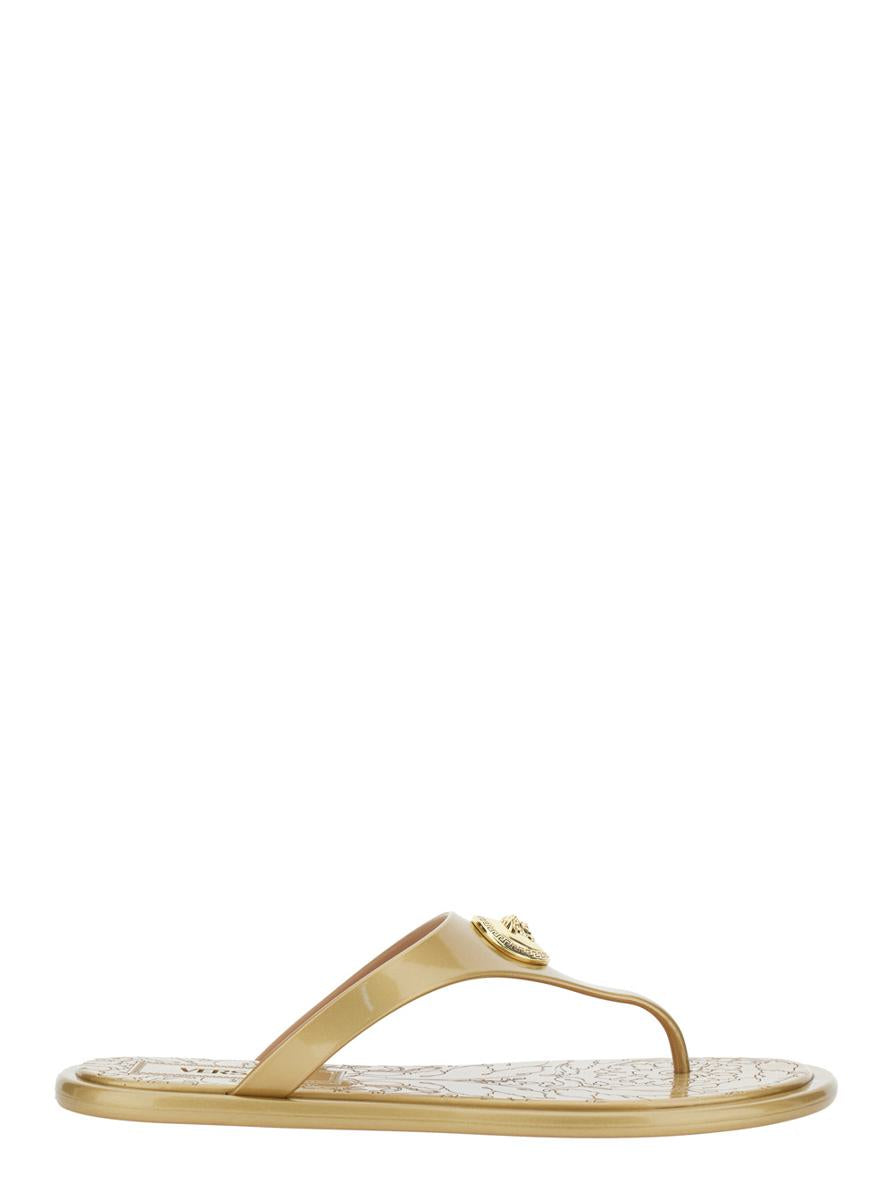 Beige Thong Slided With Medusa Plaque On The Front And Laminated Design In Tech Fabric Woman