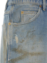 Light Blue Jeans With Ripped Details And Distressed Effect In Denim Man