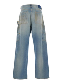 Light Blue Jeans With Ripped Details And Distressed Effect In Denim Man