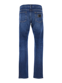 Blue Slim Jeans With Logo Patch On The Rear In Denim Man